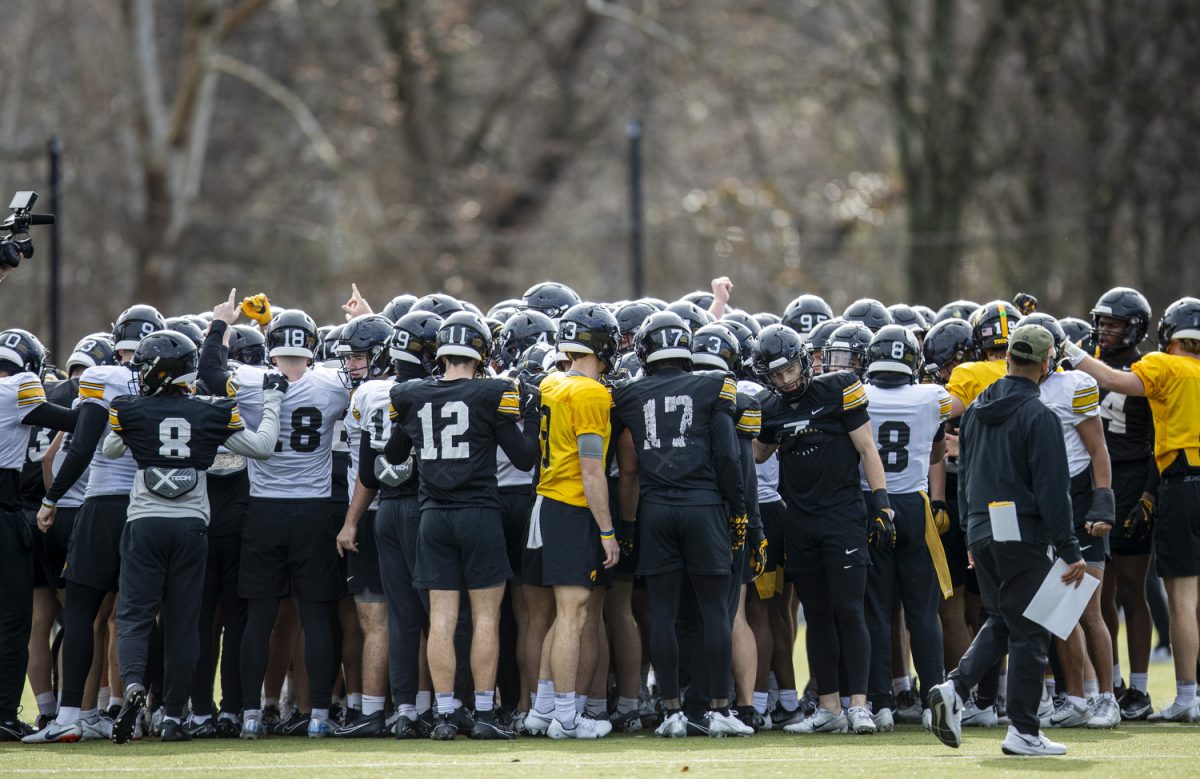 Players huddle during an Iowa football practice at Ensworth High School in Nashville, Tenn., on Friday, Dec. 27, 2024. The Iowa Hawkeyes and Missouri Tigers will face off in the 2024 TransPerfect Music City Bowl on Monday, Dec. 30, at Nissan Stadium.