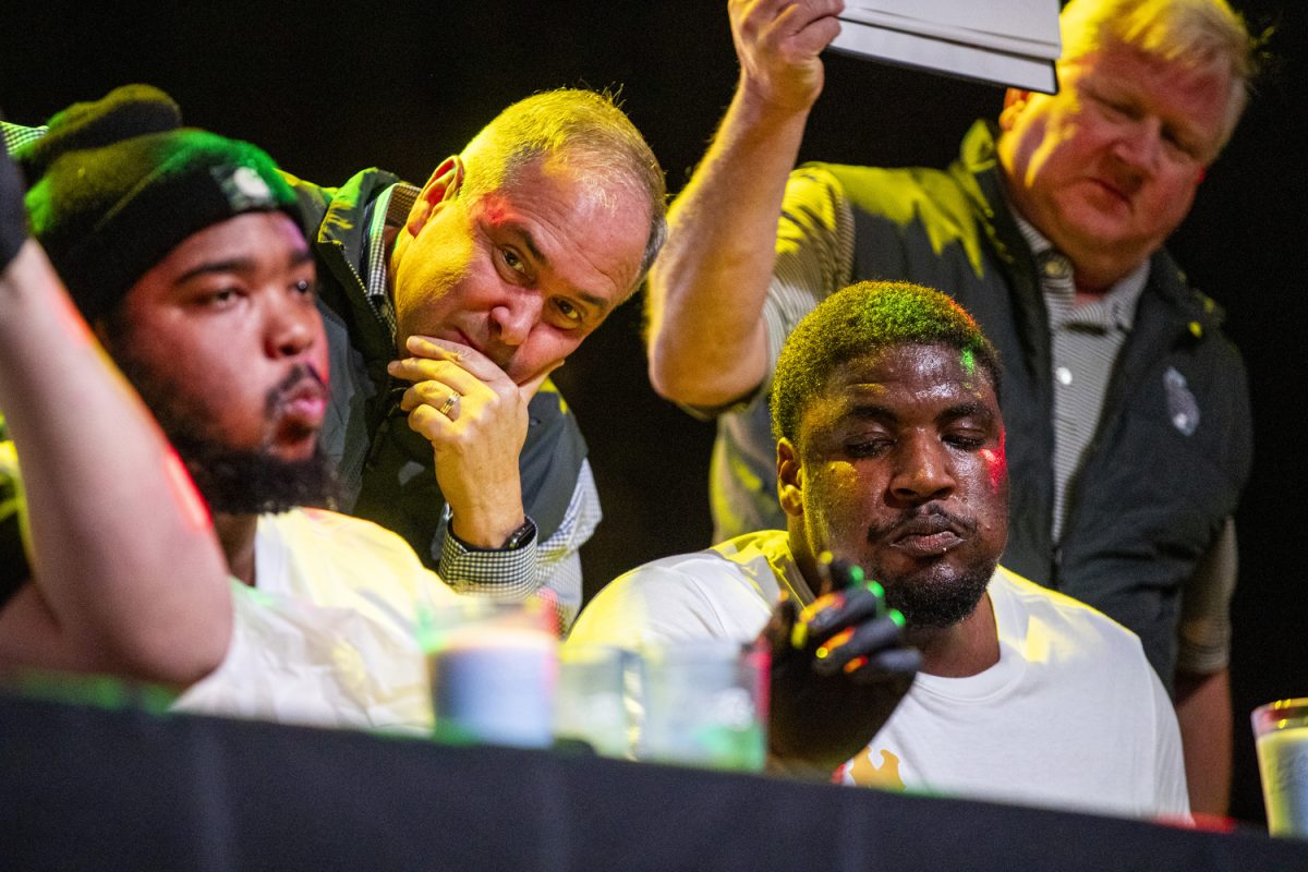 An official observes Missouri offensive lineman Curtis Peagler during a chicken wing contests team welcome party at Category 10 in Nashville, Tenn., on Friday, Dec. 27, 2024. Peagler finished with the most wings eaten. The Iowa Hawkeyes and Missouri Tigers will face off in the 2024 TransPerfect Music City Bowl on Monday, Dec. 30, at Nissan Stadium.