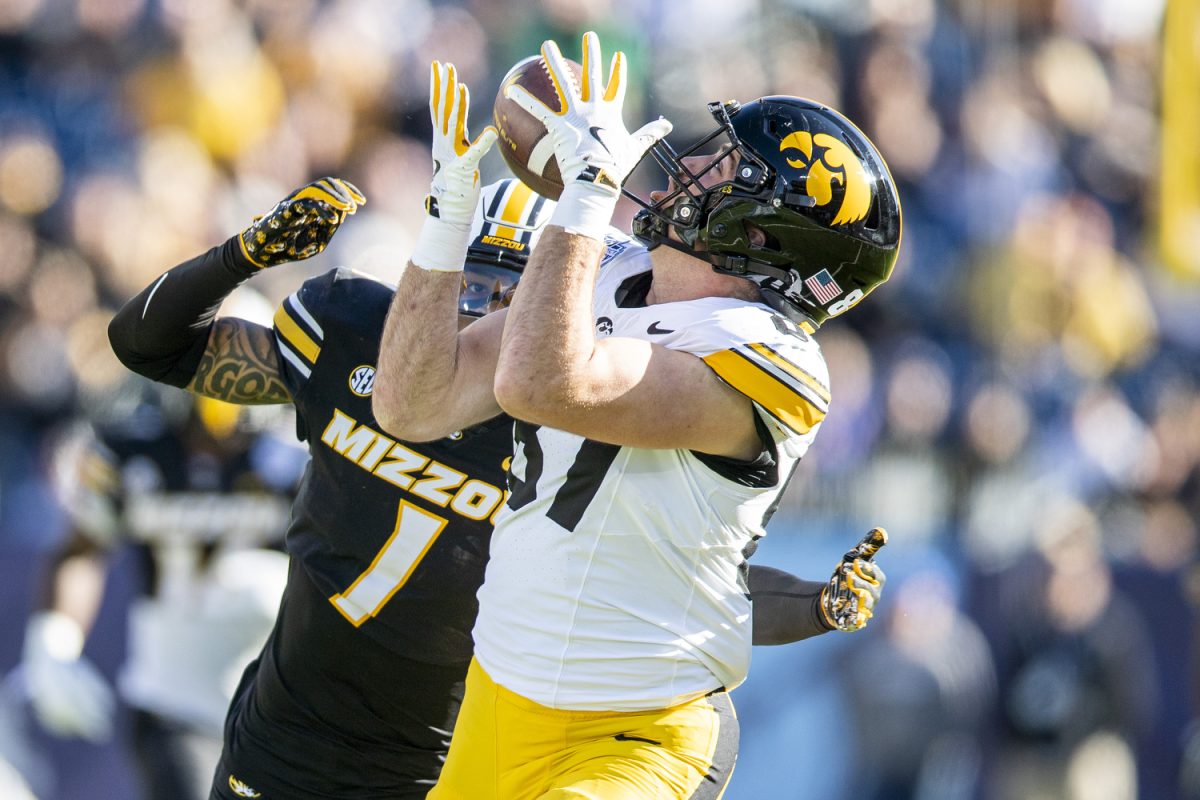 Iowa tight end Addison Ostrenga catches the ball during the TransPerfect Music City Bowl between Iowa and Missouri at Nissan Stadium in Nashville, Tenn., on Monday, Dec. 30, 2024. Following the first half, Iowa leads Missouri 21-14.