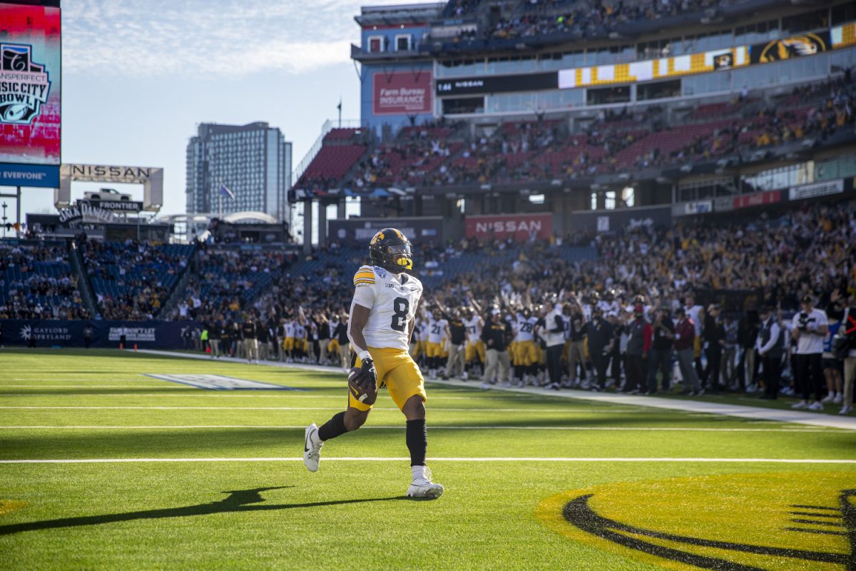 Iowa running back Terrell Washington Jr. runs into the end zone for a touchdown during the TransPerfect Music City Bowl between Iowa and Missouri at Nissan Stadium in Nashville, Tenn., on Monday, Dec. 30, 2024. Following the first half, Iowa leads Missouri 21-14.