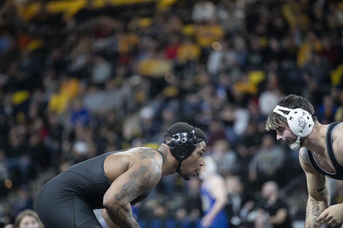 Iowa 184-pound Gabe Arnold prepares to wrestle Bellarmine Devan Hendricks during session two of Soldier Salute at Xtream Arena in Coralville on Sunday, Dec. 29, 2024. The tournament hosted men’s and women’s matches from top-ranked schools.