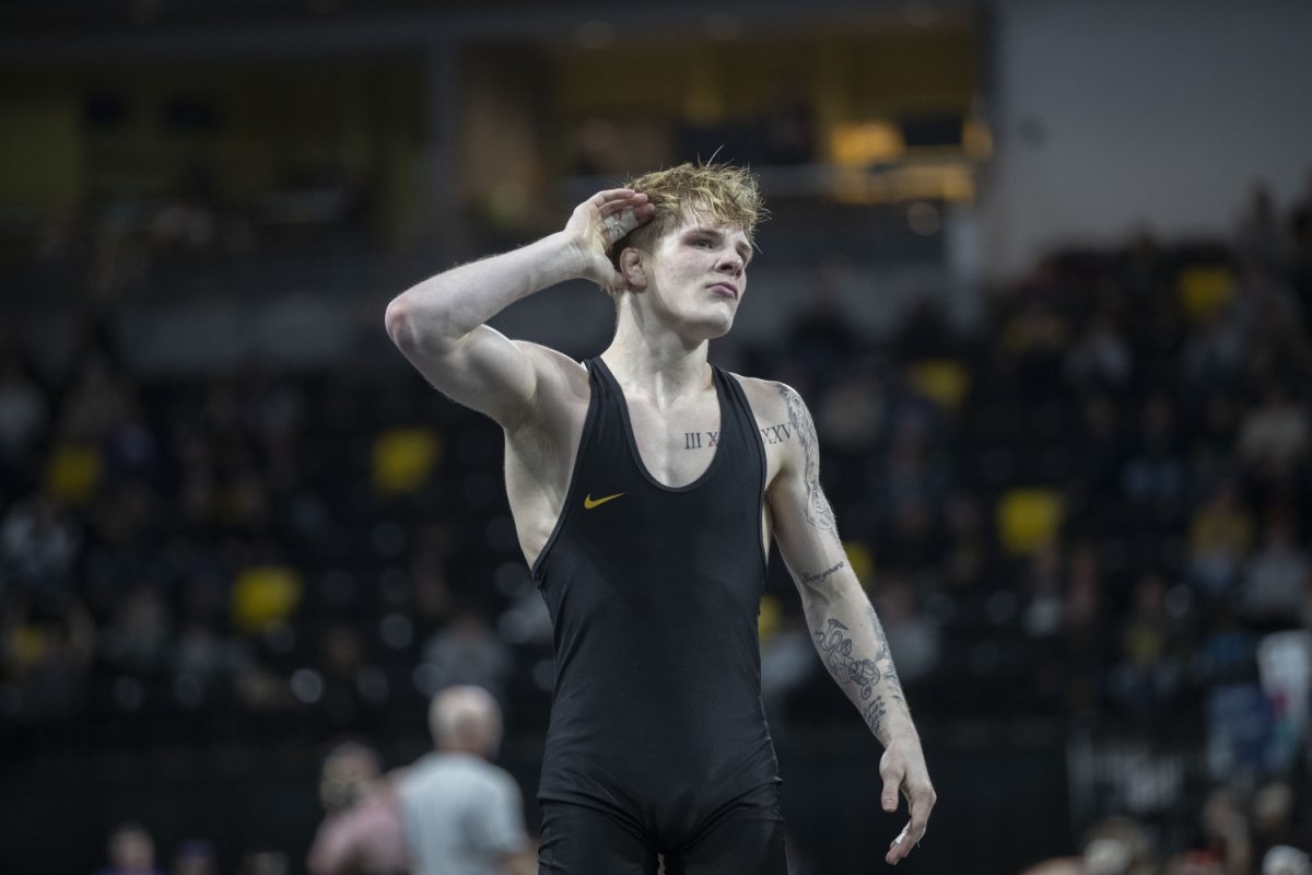 Iowa 133-pound Kale Peterson celebrates after defeating American University Max Lee during session two of Soldier Salute at Xtream Arena in Coralville on Sunday, Dec. 29, 2024. The tournament hosted men’s and women’s matches from top-ranked schools.