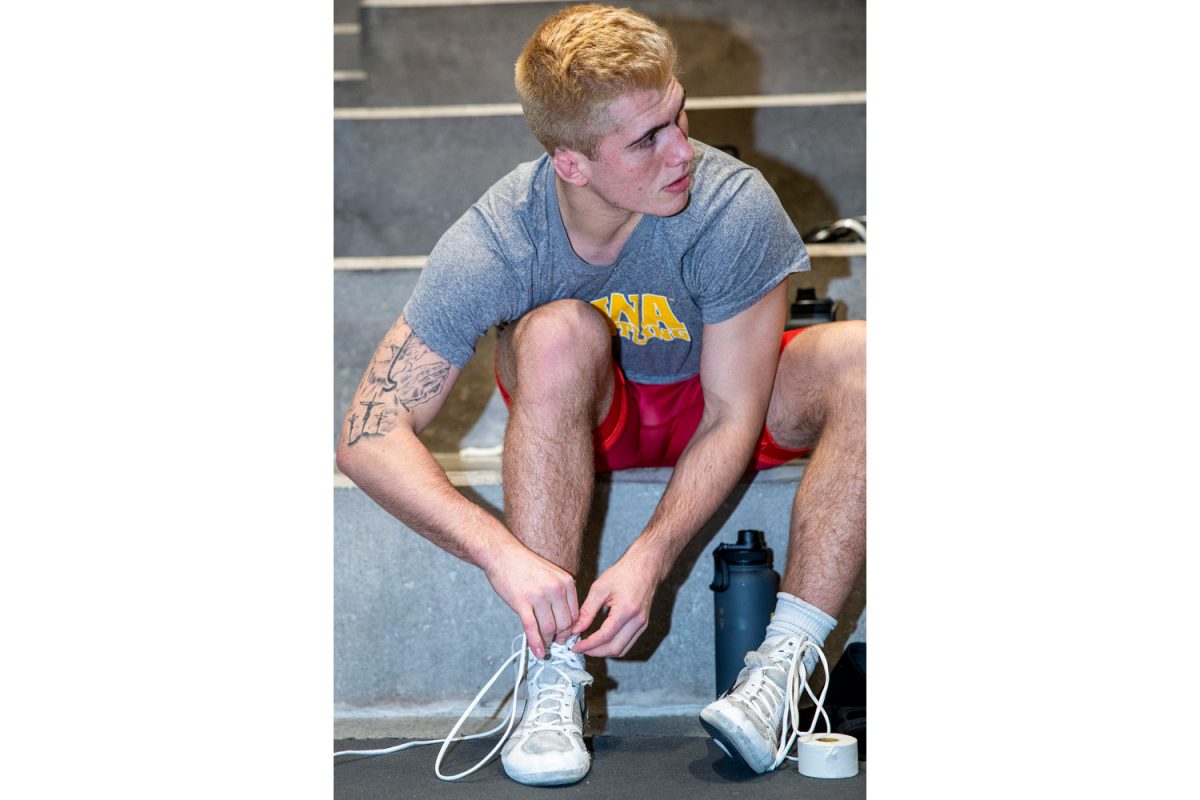 Iowa 184-pound Angelo Ferrari puts on his shoes during men’s wrestling media day at Carver-Hawkeye Arena in Iowa City, on Thursday Oct. 31, 2024. Last season, Iowa placed fifth in the NCAA Wrestling Championships with five all-Americans.