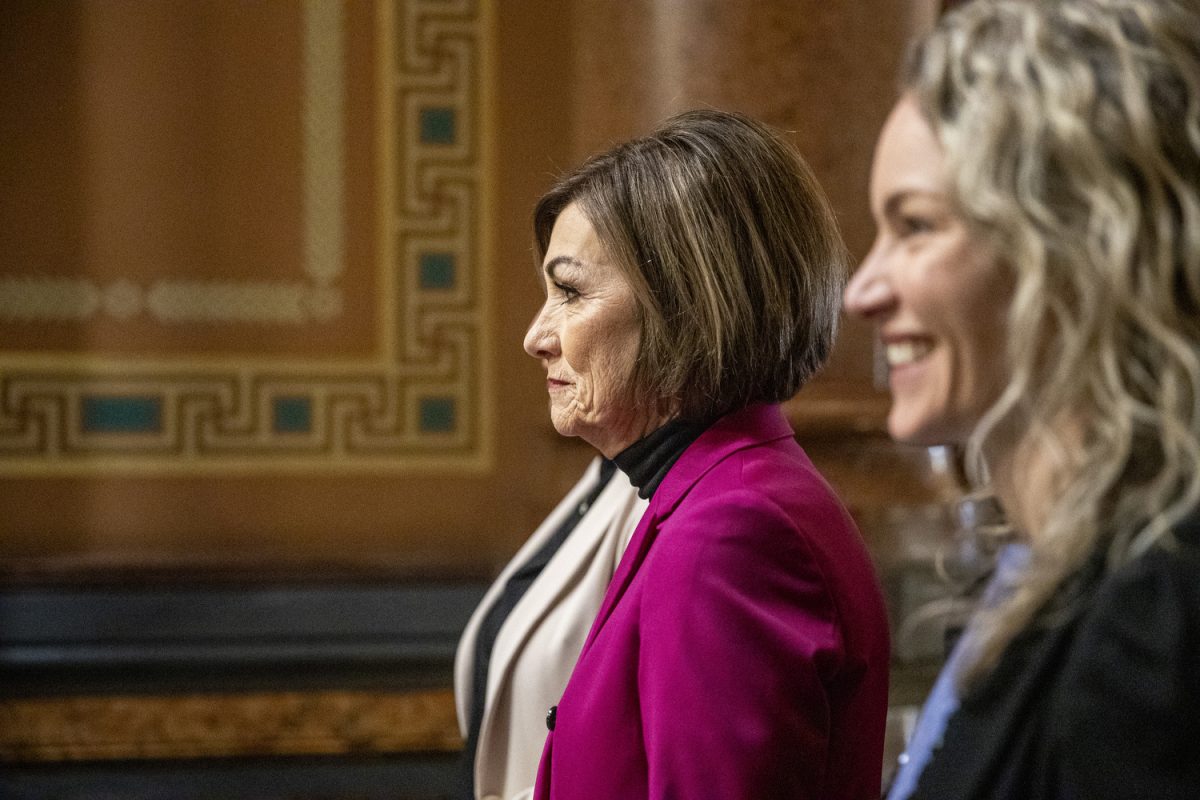 Iowa Gov. Kim Reynolds prepares to enter the House of Representatives during the Condition of the State address at the Iowa State Capitol in Des Moines on Tuesday, Jan. 14, 2025. Reynolds listed education as one of her top priorities for the 2025 legislative session. “That’s why we invested more than $3.8 billion in our public schools last year, about 43% of our state budget,” said Reynolds.