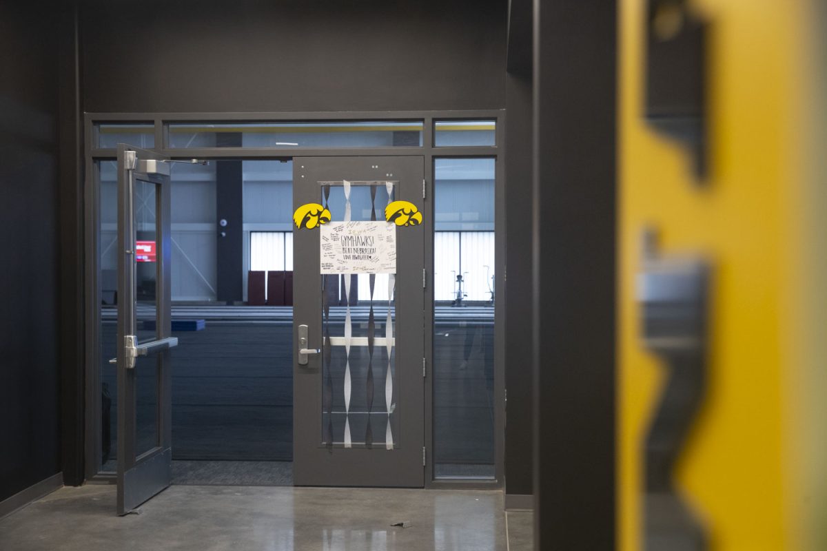 A sign from Iowa Cheer to the Gymhawks is seen in the Nagle-Duda Gymnastic and Spirit Squads Training Center on Jan. 31, 2025. The center is located off of Prairie Meadow Drive, south of Hawkeye Tennis and Recreation Complex. The practice facility provides a Marley dance floor, cheer mats, a sound system and more.