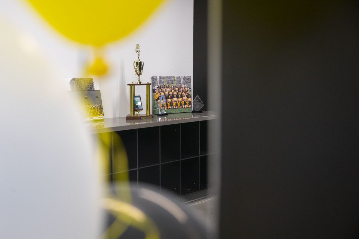 Trophies and pictures of the spirit squad are seen in the Nagle-Duda Gymnastic and Spirit Squads Training Center on Jan. 31, 2025. The center is located off of Prairie Meadow Drive, south of Hawkeye Tennis and Recreation Complex. The practice facility provides a Marley dance floor, cheer mats, a sound system and more.