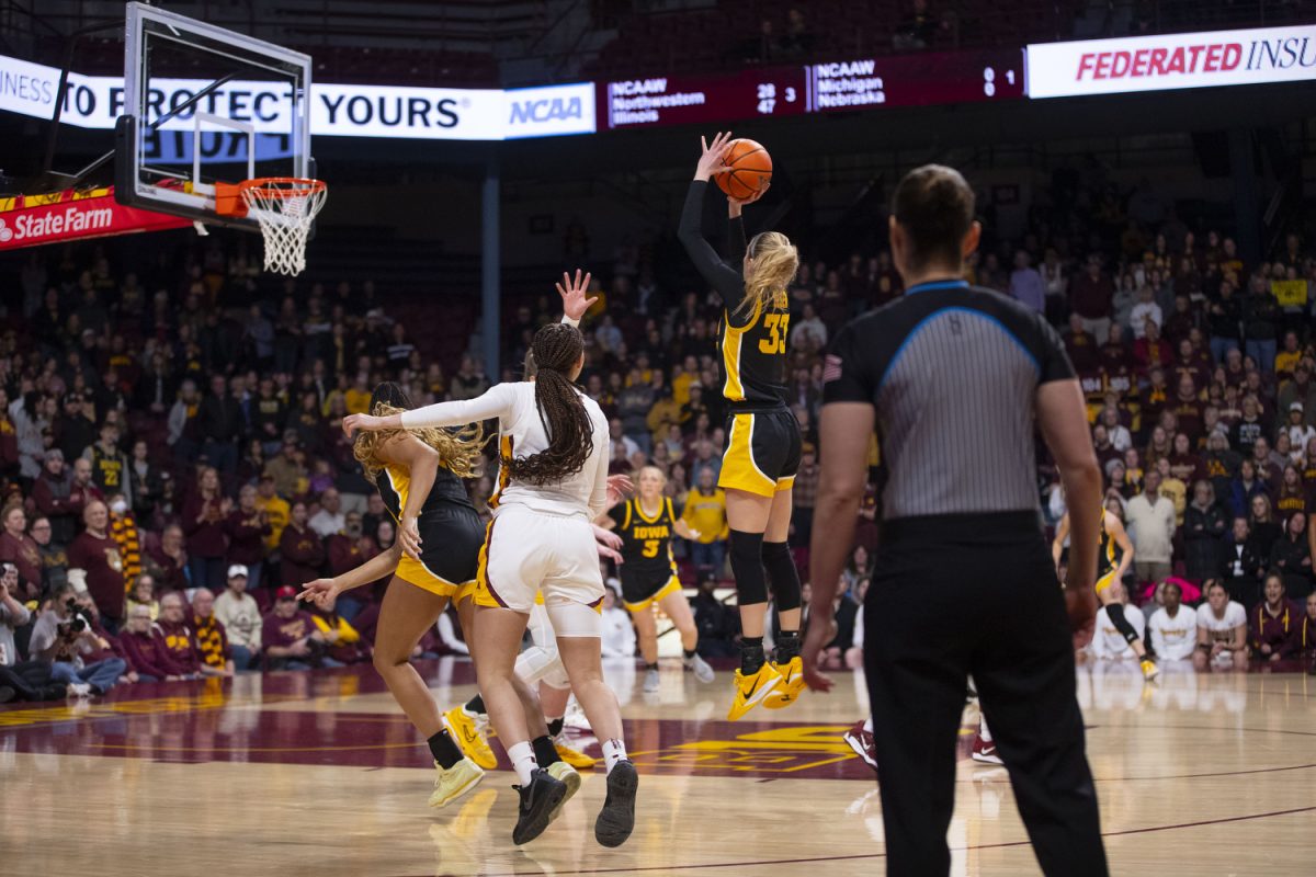 Lucy Olsen shoots the ball during a women's basketball game between Iowa and Minnesota at Williams Arena in Minneapolis, Minnesota, on Feb. 6, 2025. The Iowa Hawkeyes defeated the Minnesota Golden Gophers 68-60.
