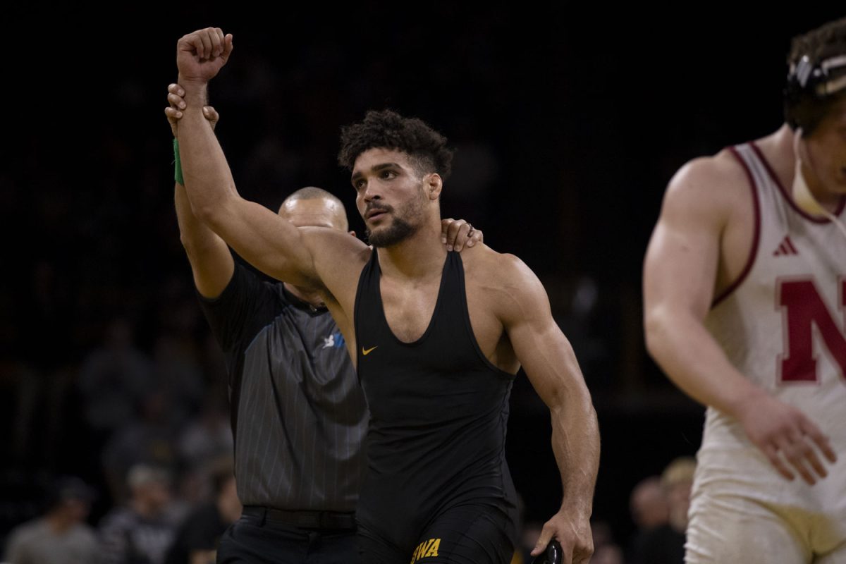 Iowa’s 197 pounder, #1 ranked Stephen Buchanan gets his hand raised after defeating Nebraska’s #20 ranked Camden McDaniel during the annual Pioneer Men’s Wrestling dual at Carver Hawkeye Arena, Iowa City, IA on February 7, 2025, in which the #3 ranked Iowa Hawkeyes defeated the #7 ranked Nebraska Huskies 19-16. Buchanan, against the odds of Nebraska’s dominating lead for majority of the dual, would pin McDaniel, allowing the Hawkeyes to comeback and win the dual.
