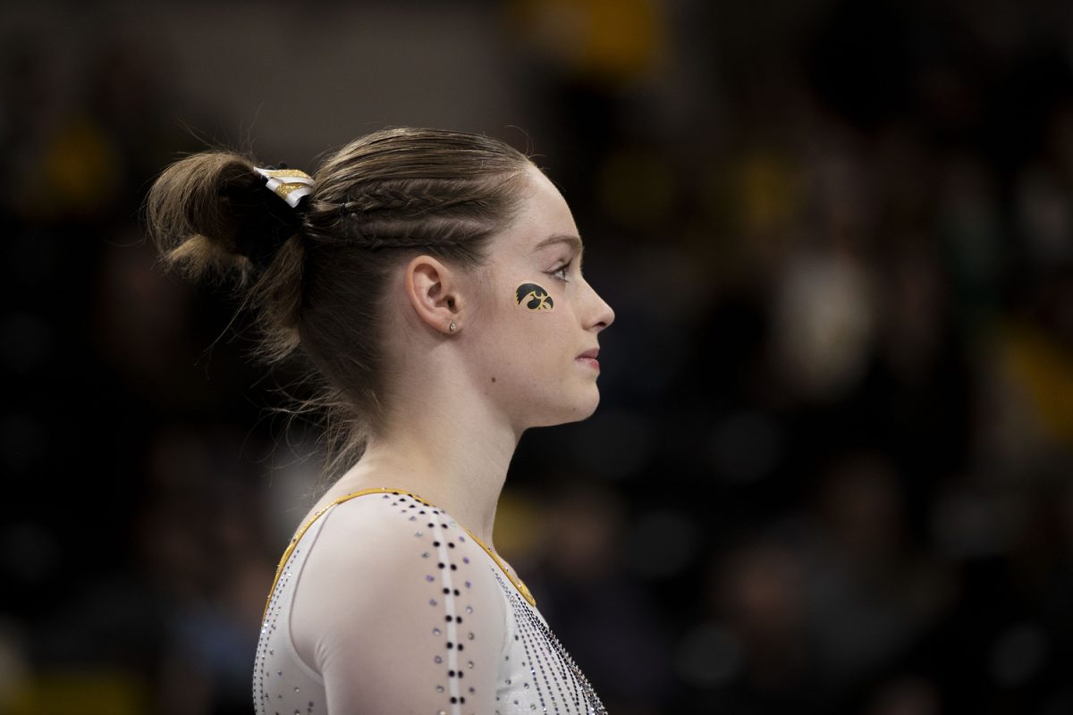 Sydney Turner focuses as she prepares for the floor exercise during a gymnastics meet between Iowa and Rutgers at Xtreme Arena on Sunday, Feb. 9, 2025