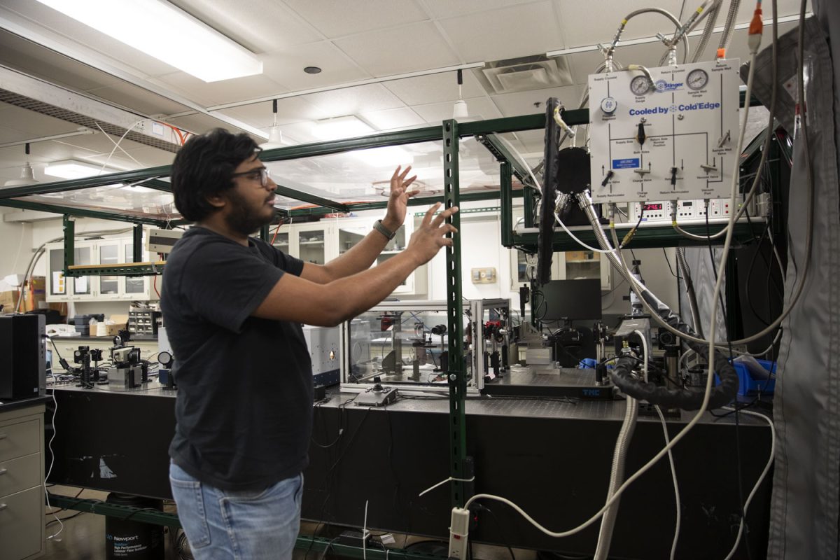 Grad student Ramachandra Bangari explains the cooling system for the microscope at the Iowa Advanced Technology Labs on Feb. 15, 2025. Bangari and other researchers at the University of Iowa recently created a homemade infrared cryo microscope through a study led by Iowa professor Thomas Folland. 