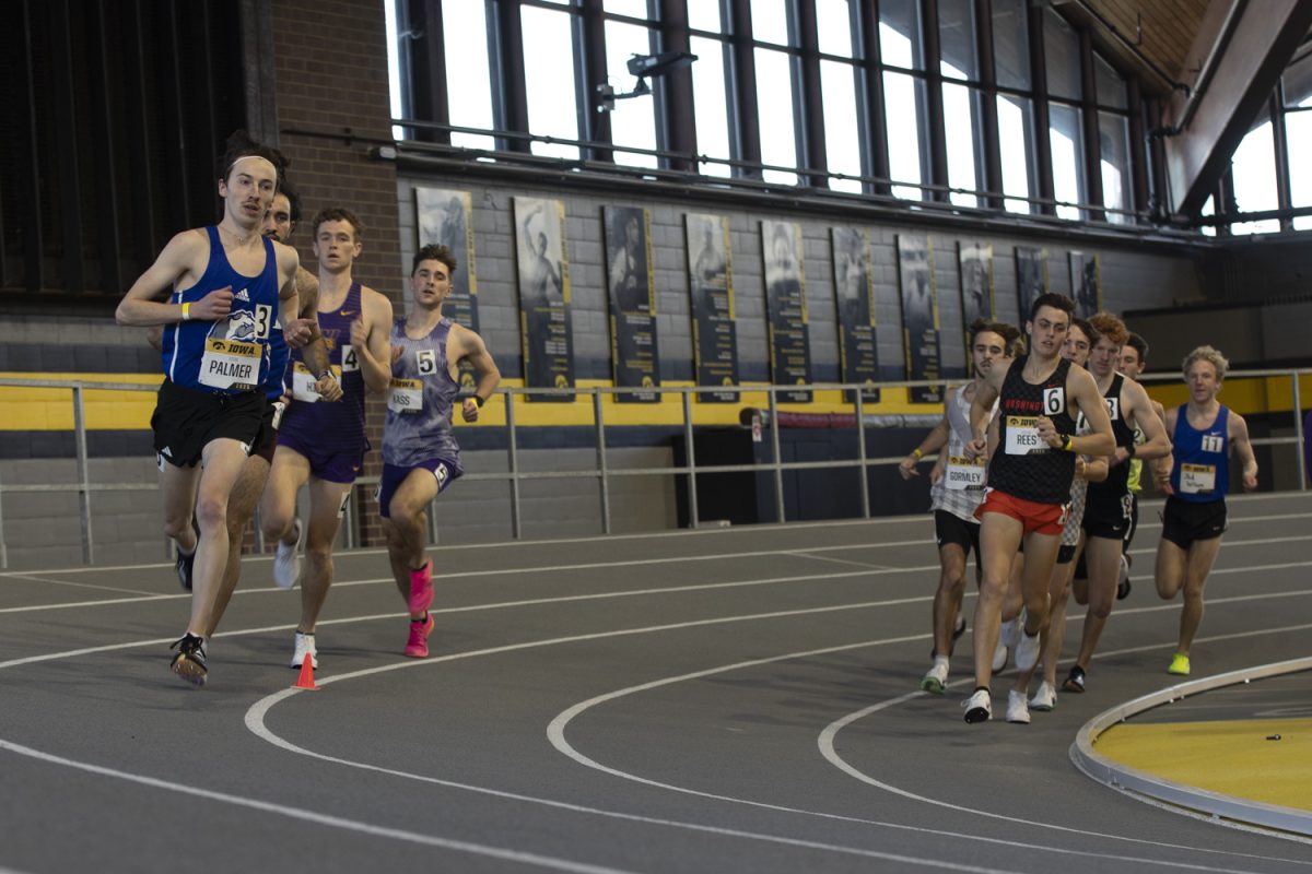 Runners compete in the men’s 3000 meter during the Iowa Open track and field meet at the Hawkeye Indoor Track Facility in Iowa City on Friday, Feb. 21, 2025.