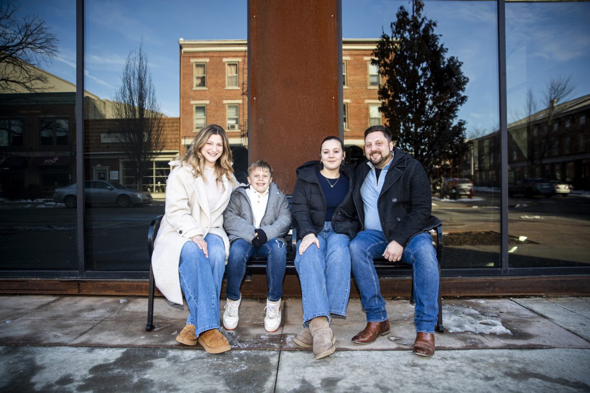 The Nusser family poses for a portrait in downtown Iowa City on Sunday, Feb. 23, 2025. 