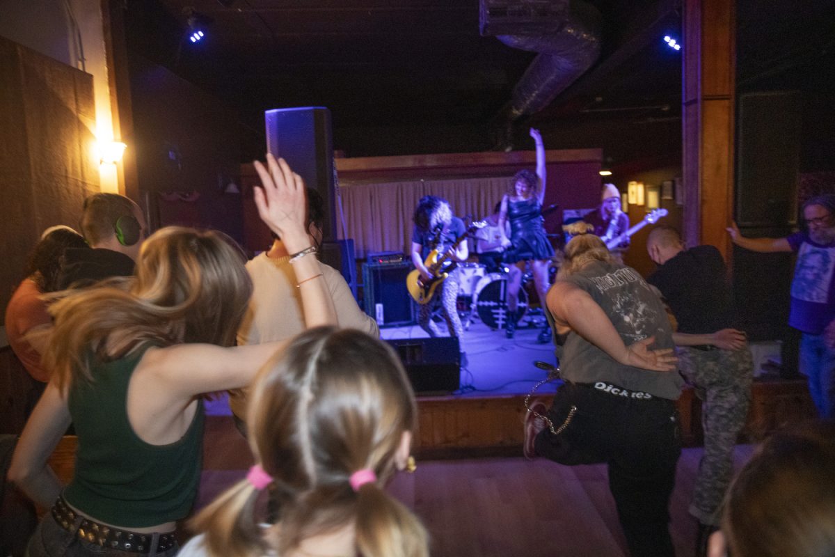 Attendees mosh to Bootcamp during a Get Out The Vote show for Oliver Weilein’s City Council campaign at Trumpet Blossom on Thursday, Feb. 27, 2025. Multiple artists performed screams, poetry, and folk songs, including Weilein’s band Bootcamp.