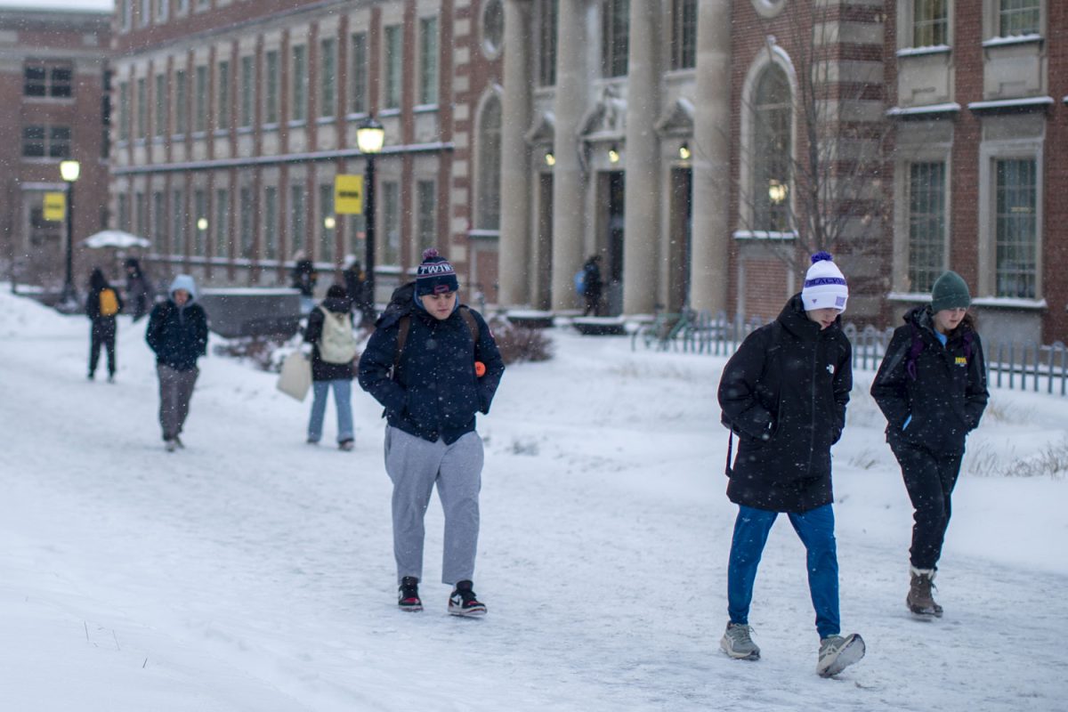 Students walk to class during a snowstorm on the UI campus in Iowa City on Wednesday, Feb. 12, 2025. Multiple professors cancelled class after Iowa City reported an expected 6-9 inches of snow.