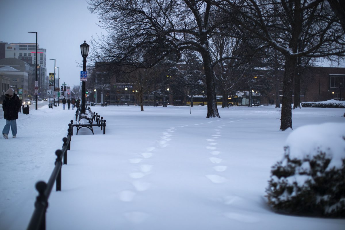 Footsteps are seen across the Pentacrest during a snowstorm on the UI campus in Iowa City on Wednesday, Feb. 12, 2025. Multiple professors cancelled class after Iowa City reported an expected 6-9 inches of snow.