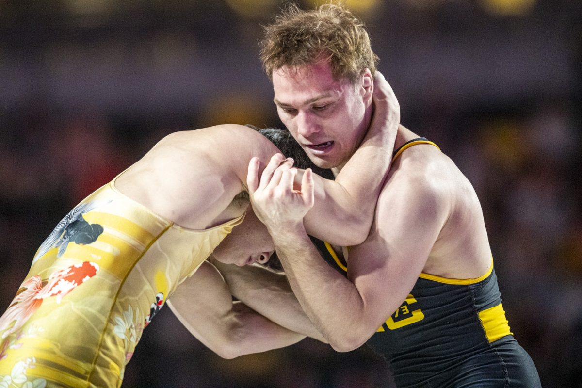 American silver medalist 59-kilogram Spencer Lee prepares to wrestles Japanese gold medalist Masanosuke Ono during FloWrestling Night in America at Xtream Arena in Coralville, Iowa on Wednesday, Feb. 26, 2025. Ono defeated Lee 3-2. 