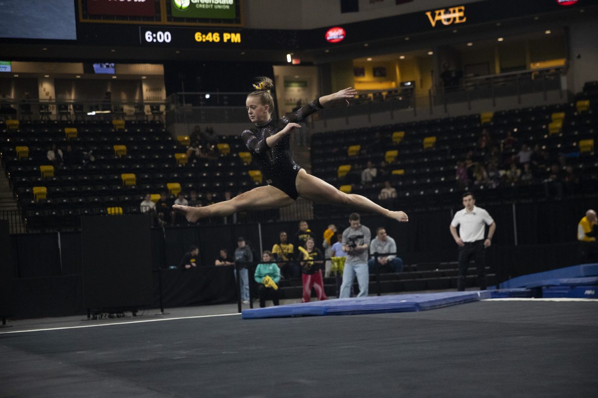 Iowa gymnast Haley Tyson completes a split jump during the meet between the Iowa, Michigan State, Washington, and Penn State at Xtream Arena on March 2, 2025. Tyson scored a 9.725 on the floor exercise.