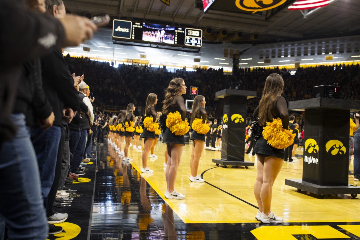 The Iowa Spirit Squad waits for players to be announced during a women's basketball game between Iowa and Wisconsin at Carver-Hawkeye Arena in Iowa City on Sunday, March. 2, 2025.