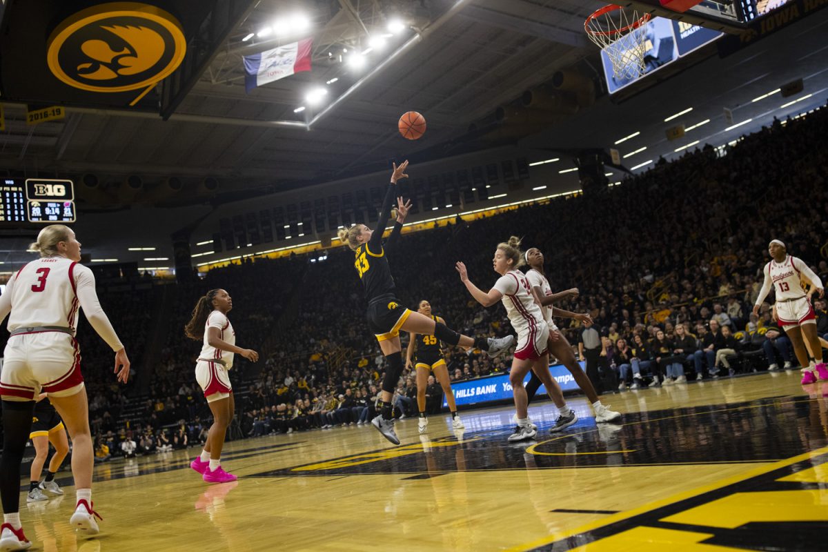 Iowa guard Lucy Olsen shoots the ball during a women's basketball game between Iowa and Wisconsin at Carver-Hawkeye Arena in Iowa City on Sunday, March. 2, 2025.