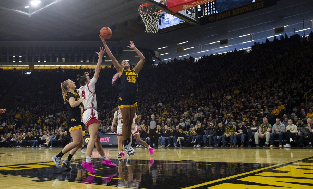 Iowa forward Hannah Stuelke rebounds the ball during a women's basketball game between Iowa and Wisconsin at Carver-Hawkeye Arena in Iowa City on Sunday, March. 2, 2025. The Iowa Hawkeyes defeated the Wisconsin Badgers 81-66.