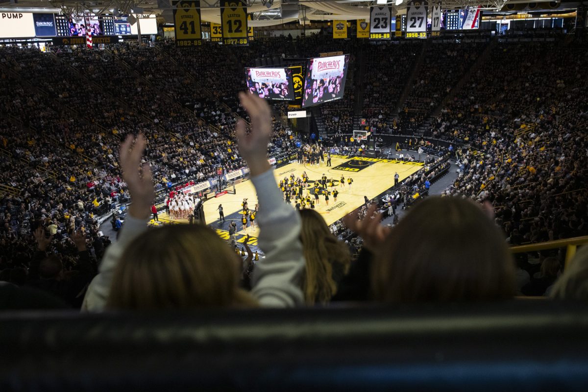 Fans participate in the Pancheros burrito lift during a women's basketball game between Iowa and Wisconsin at Carver-Hawkeye Arena in Iowa City on Sunday, March. 2, 2025. The Iowa Hawkeyes defeated the Wisconsin Badgers 81-66.