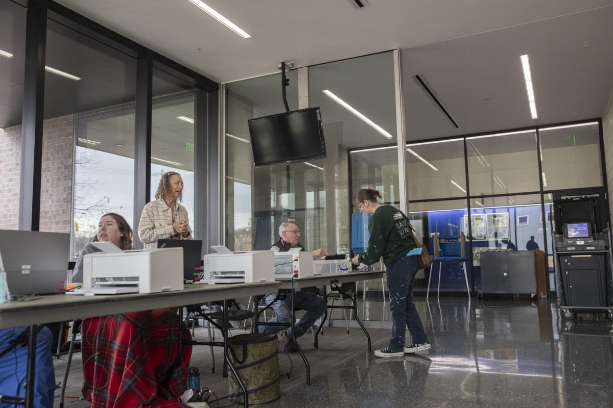 A voter turns in their ballot at the Campus Recreation and Wellness Center voting station during the Iowa City City Council special election on Tuesday, Mar. 4, 2025. Polls will close at 8 p.m.