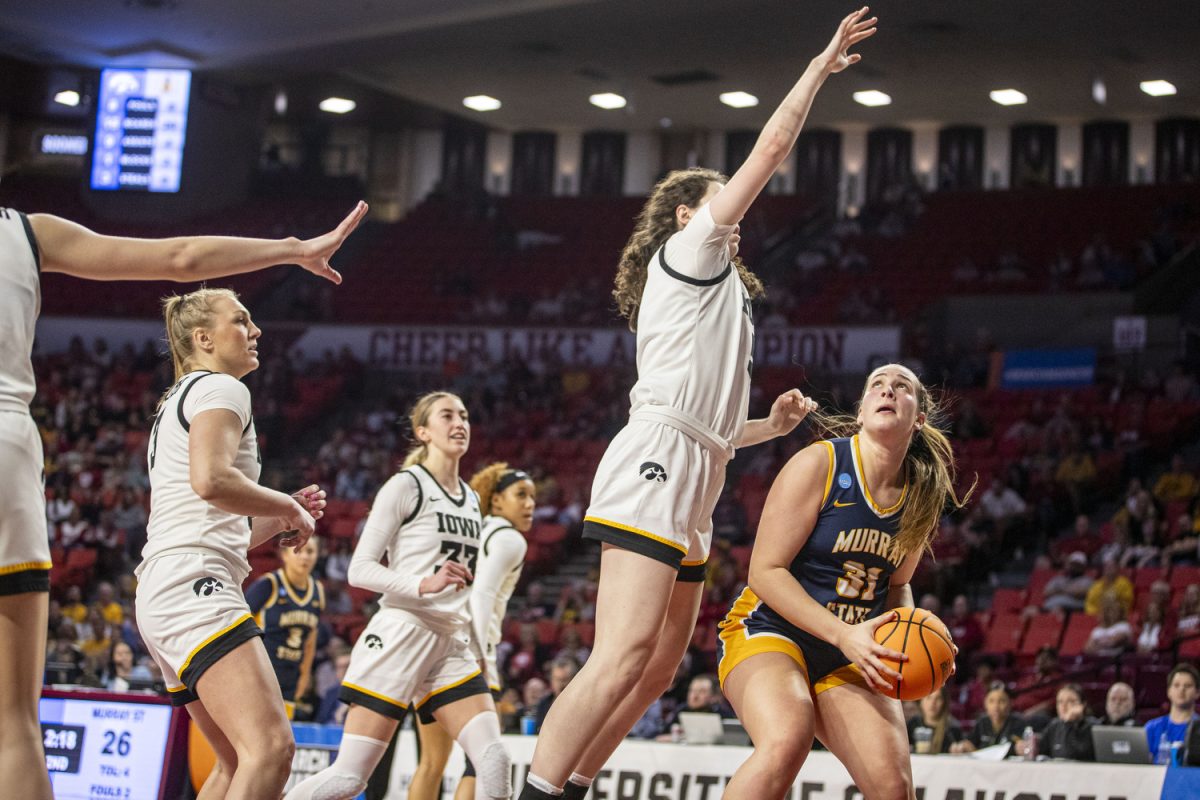 Iowa center Ava Heiden guards Murray State forward Katelyn Young during a NCAA Tournament First Round game between the No. 6 Iowa Hawkeyes and the No. 11 Murray State Racers at Lloyd Noble Center in Norman, Okla., on Saturday, March 22, 2025. 
