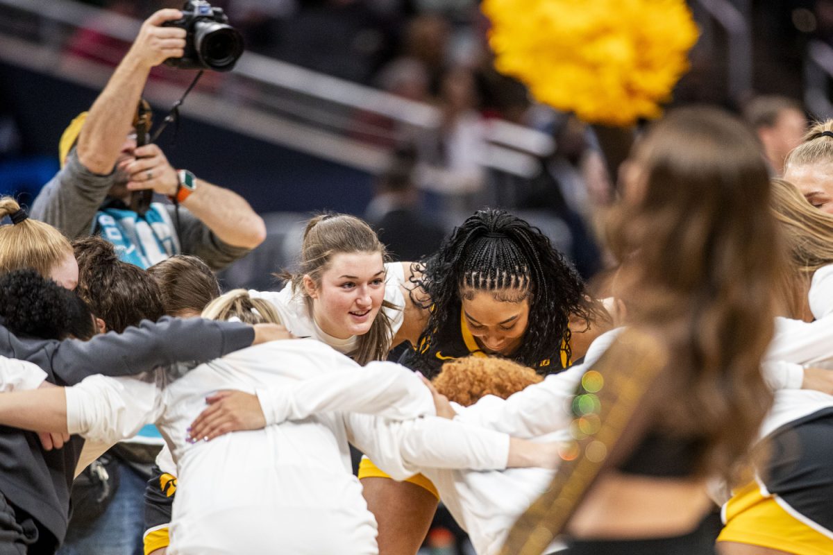 Iowa players huddle before a basketball game between No. 11 Iowa and No. 3 Ohio State at the TIAA Big Ten Women’s Basketball Tournament at Gainbridge Fieldhouse in Indianapolis, Ind. on Friday, March 7, 2025. 