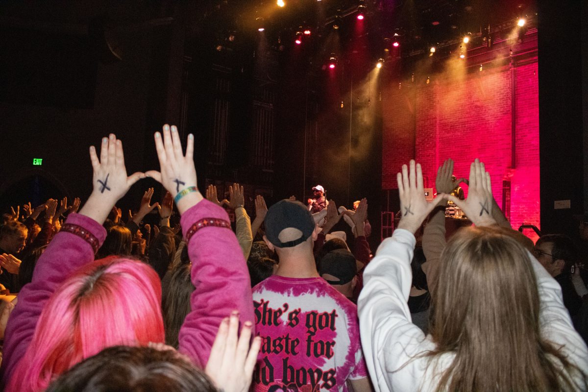 Audience members hold up Ws for the Wu-Tang Clan at a Raekwon concert on Saturday, April 5, 2025. The event was part of Mission Creek, the art and music festival which celebrates its 20th anniversary this year.