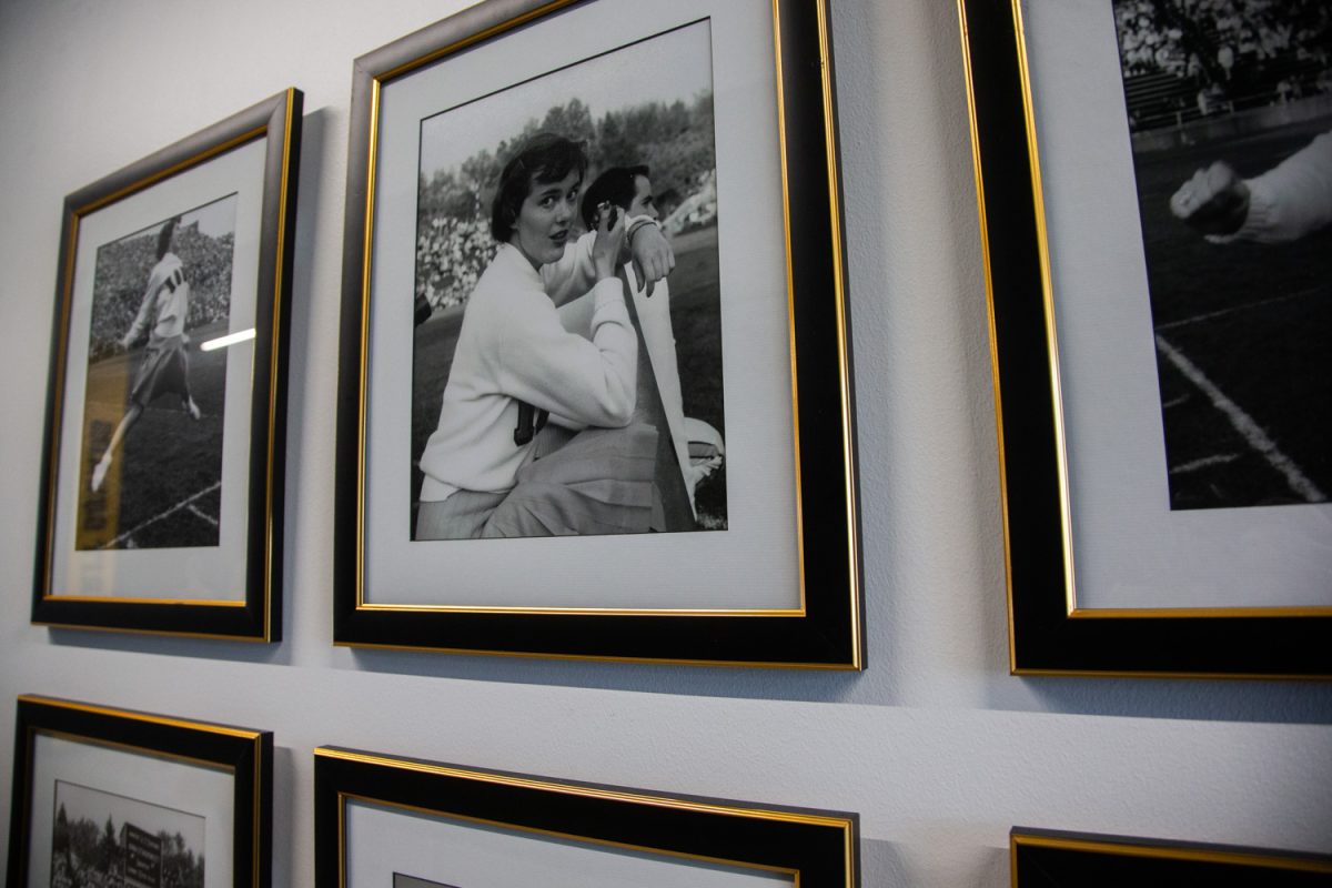 Old photos of the University of Iowa cheer squad is seen during the grand opening ceremony of the Nagle-Duda Gymnastic &amp; Spirit Squads Training Center in Iowa City on Thursday, April 10, 2025. The facility was finished in 2024 and sits across the street from the women’s soccer facility on Prairie Meadow Drive.