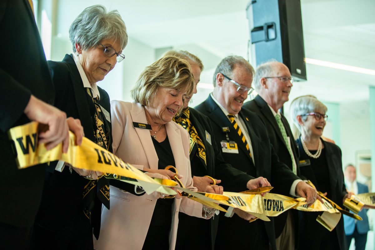 Iowa Board of Regents President Sherry Bates (left), University of Iowa President Barbara Wilson (second from left), and other University and healthcare faculty pose for portraits during a ribbon cutting event for the University of Iowa Health Care North Liberty Campus inside the entrance lobby of the hospital on Friday, April 11, 2025. The North Liberty Hospital is set to open for patient care on Monday, April 28, 2025.