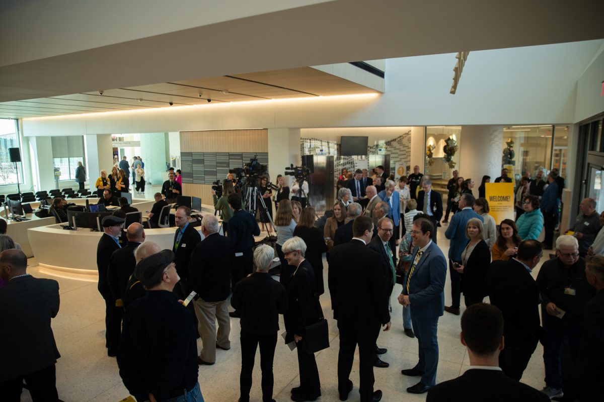 Attendees file in before a ribbon cutting event for the University of Iowa Health Care North Liberty Campus inside the entrance lobby of the hospital on Friday, April 11, 2025. The North Liberty Hospital is set to open for patient care on Monday, April 28, 2025.