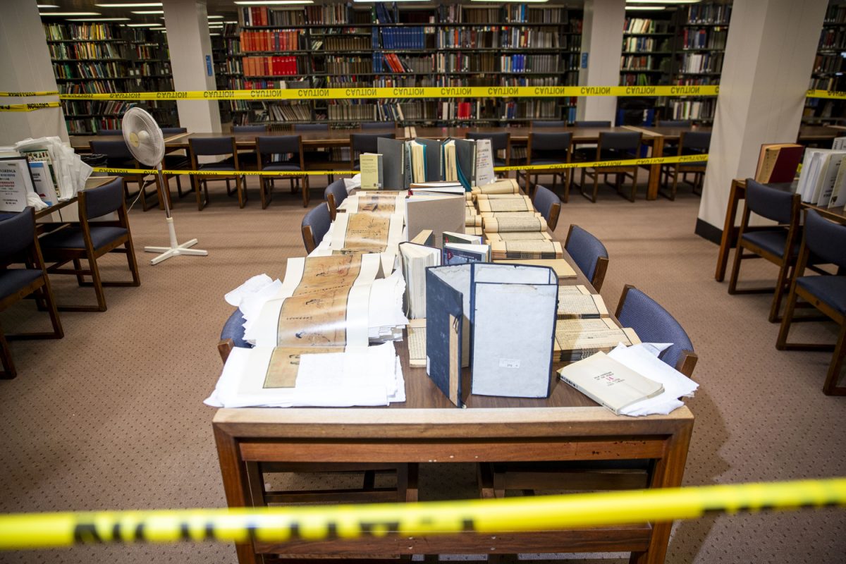 Academic texts and other literature in the East Asian text collection are seen in the University of Iowa Main Library in Iowa City on Monday, April 14, 2025. A pipe burst in an office of the library, effectively leaking water across multiple floors. Damage is uncertain and expected to be minimal, but many documents were moved or set out to dry throughout the day and into Tuesday morning. Cleaning is ongoing, and the Reading Room will reopen on Monday. 