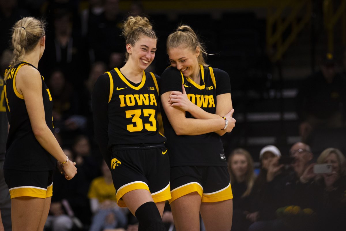 Iowa guard Lucy Olsen and Iowa guard Sydney Affolter wait to speak on behalf of the senior class during a women’s basketball game between Iowa and Wisconsin at Carver-Hawkeye Arena in Iowa City on Sunday, March. 2, 2025. The Iowa Hawkeyes defeated the Wisconsin Badgers 81-66.