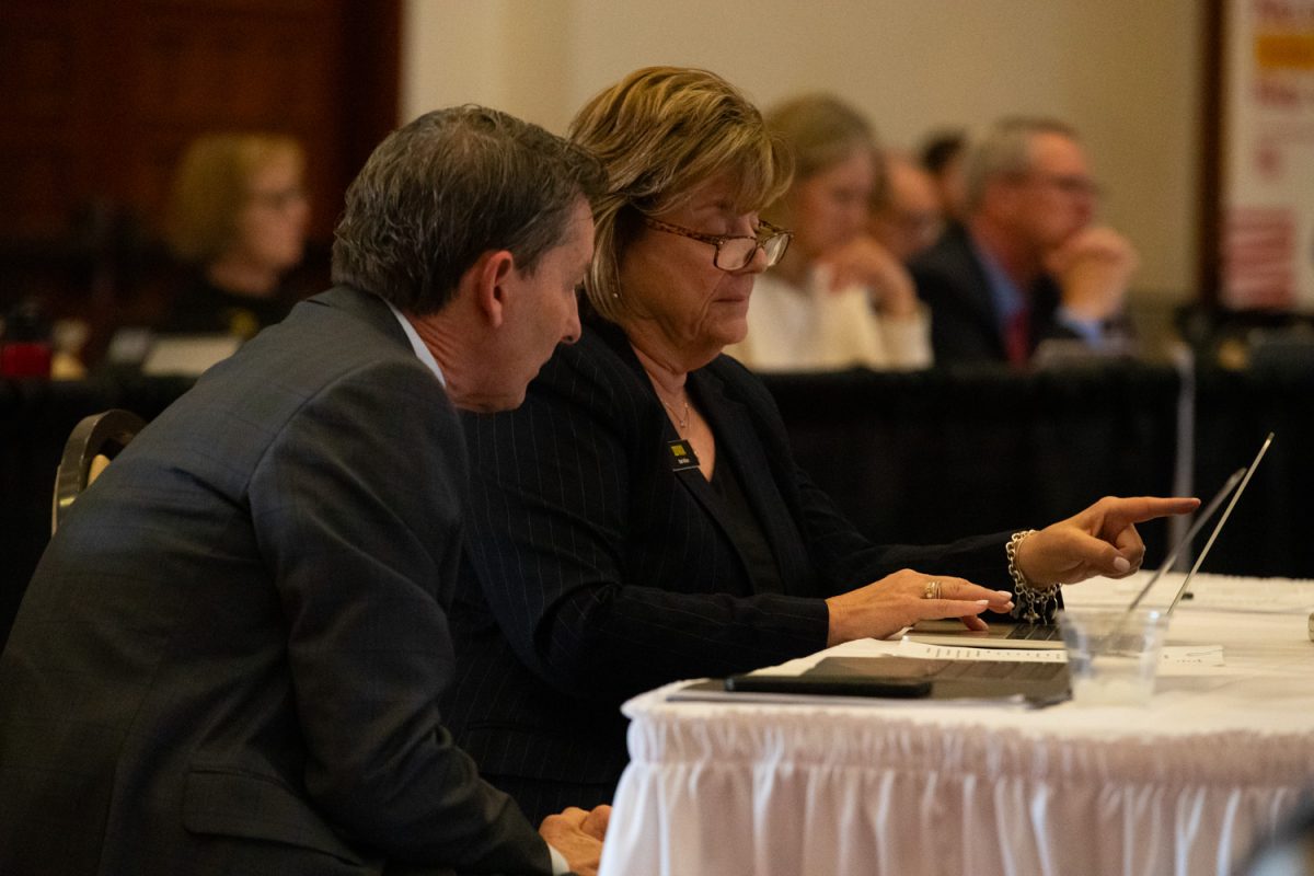 University of Iowa President Barbara Wilson speaks to Provost Kevin Kregel during a board meeting in Ames, Iowa on April 23, 2025.
