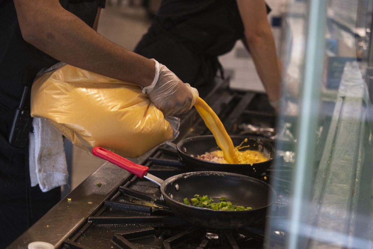 A cook at Catlett Marketplace makes an omelet at the Sunnyside Up station on Friday, May 2, 2025. University Housing and Dining has been affected by the nationwide egg shortage in recent weeks.