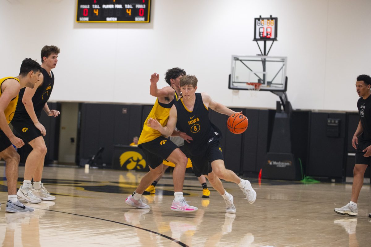 Cooper Koch drives the ball during an Iowa mens basketball practice at Carver-Hawkeye Arena on Thursday June 19, 2025.