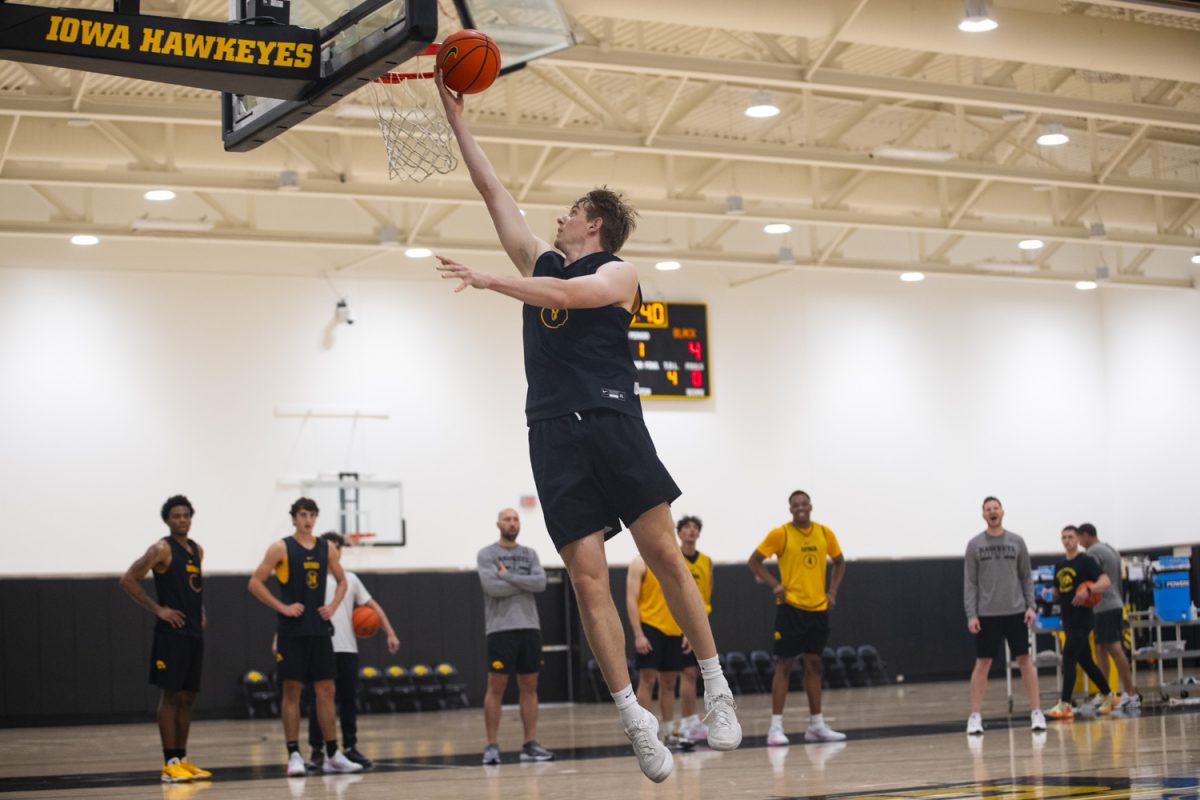 Cooper Koch goes up for a shot during an Iowa mens basketball practice at Carver-Hawkeye Arena on Thursday June 19, 2025.