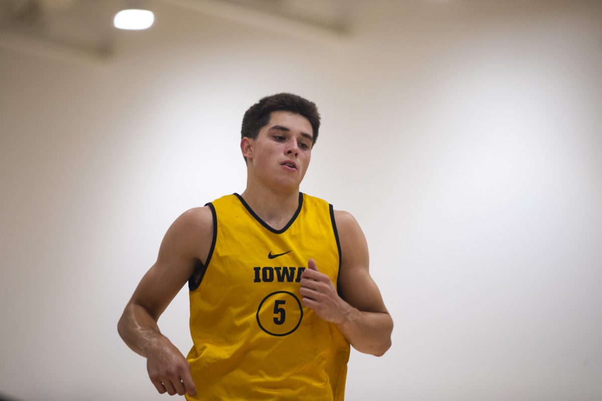 Peyton McCollum runs during an Iowa mens basketball practice at Carver-Hawkeye Arena on Thursday June 19, 2025.