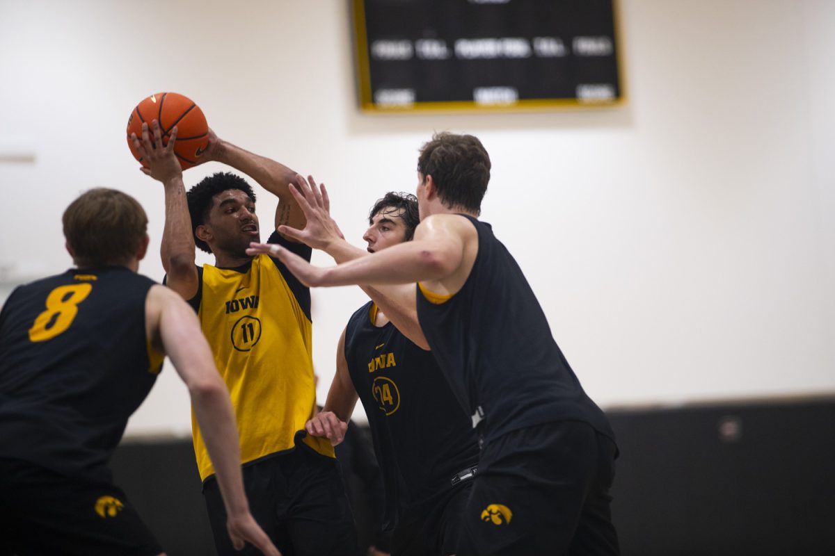 Kael Combs looks for a pass during an Iowa mens basketball practice at Carver-Hawkeye Arena on Thursday June 19, 2025.