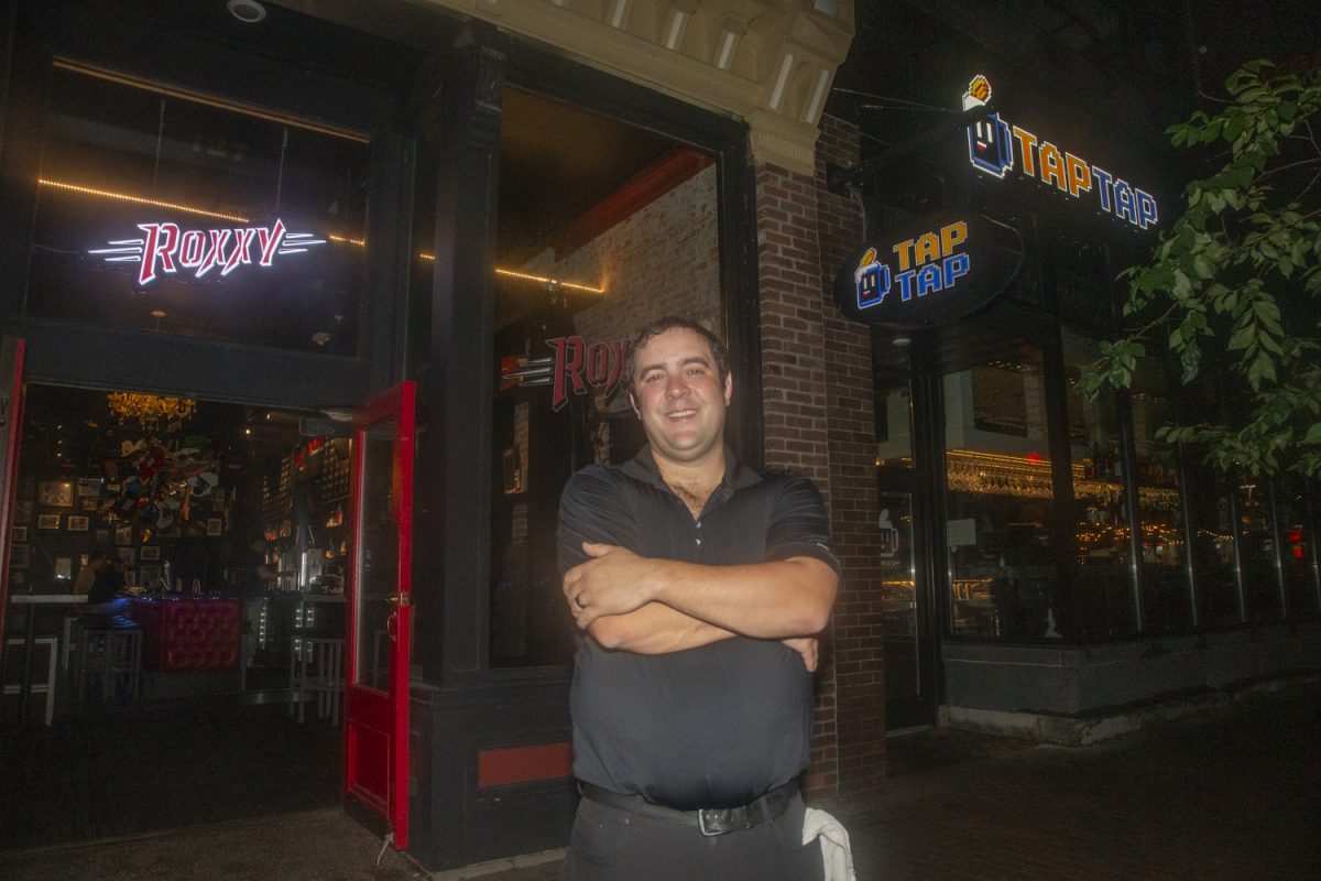 Executive General Manager Conor Schley poses for a portrait outside of Roxxy and Double Tap in downtown Iowa City on Friday, Aug. 15, 2025. The Stuffed Olive, Roxxy, and Double Tap are all part of a chain of bars based in Cedar Falls, IA and owned by Harmonic Hospitality Group.