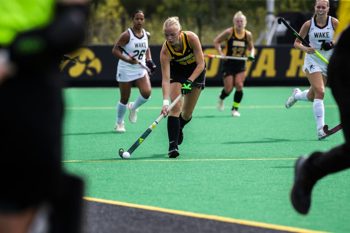 Iowa midfielder Dionne Van Aalsum pushes down the field during a field hockey game between No. 15 Iowa and No. 20 Wake Forest at Grant Field in Iowa City on Friday, Aug. 29, 2025. The Hawkeyes defeated the Demon Deacons 5-4.