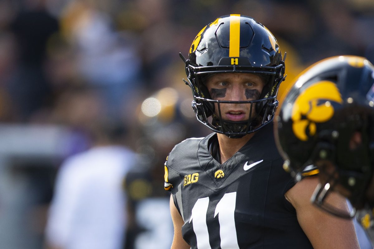 Iowa quarterback Mark Gronowski warms up before a football game between Iowa and Albany at Kinnick Stadium on Saturday, Aug. 30, 2025.