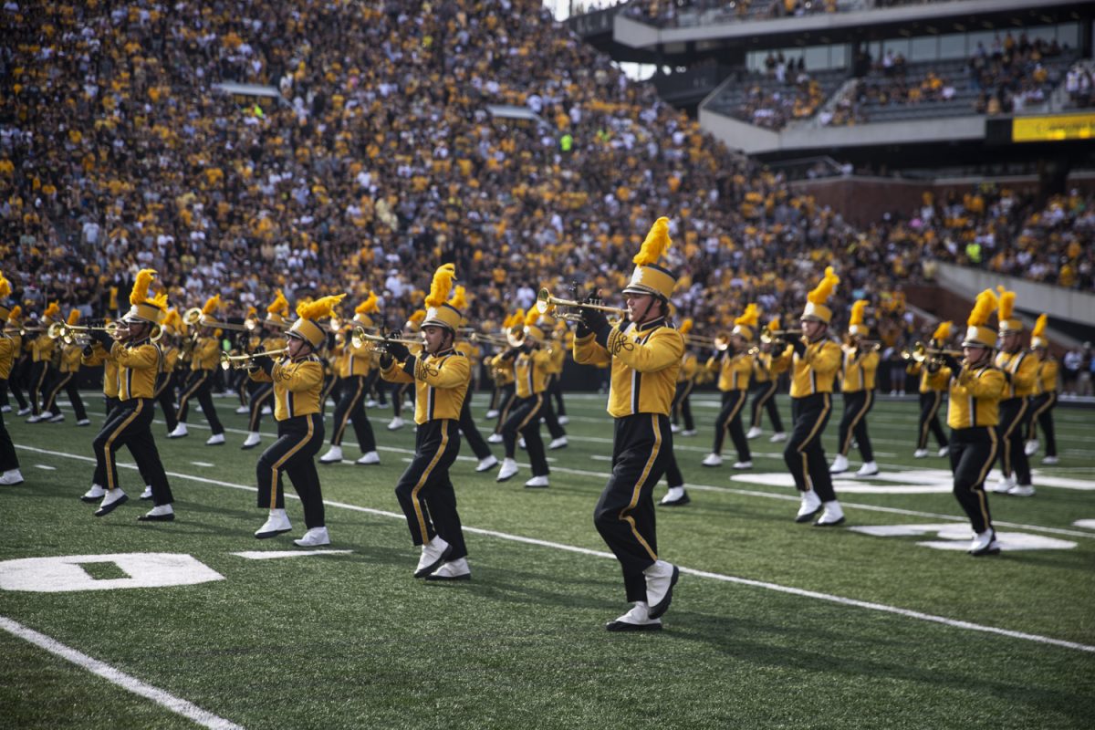 The Hawkeye Marching Band plays on the field during a football game between the Iowa Hawkeyes and the Albany Great Danes at Kinnick Stadium on Saturday, Aug. 30, 2025. The Hawkeyes defeated the Great Danes 34-7.