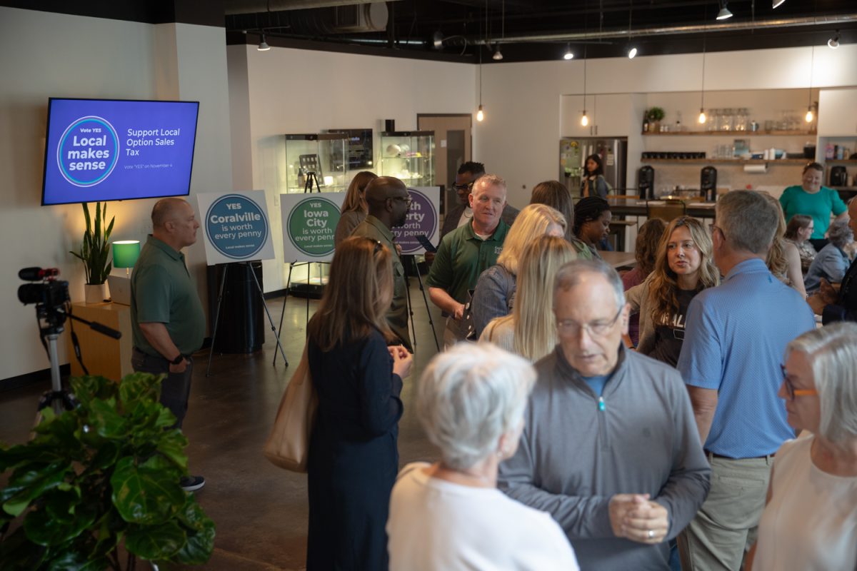 Iowa City residents gather before a community meeting on a local sales option tax at MERGE in Iowa City on Tuesday, Sept. 2, 2025. Dozens of local residents, from Iowa City, Coralville, and North Liberty attended the meeting.