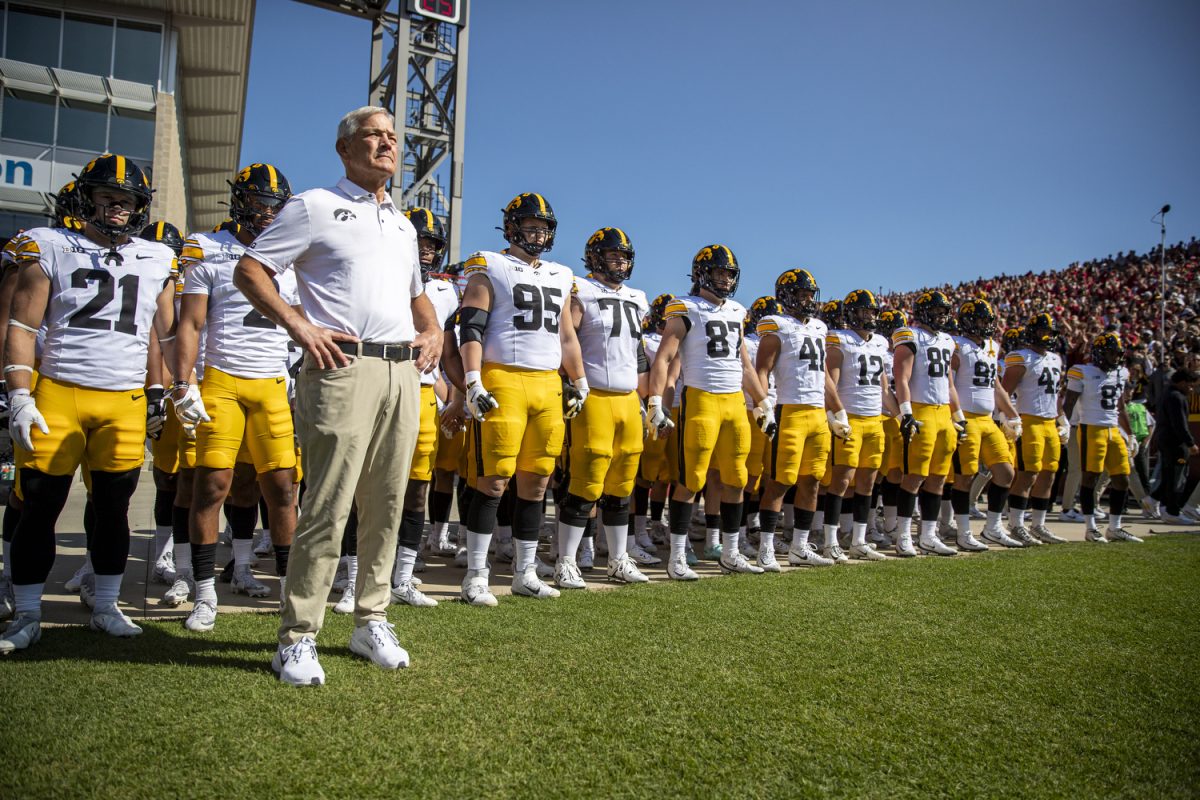Iowa head coach Kirk Ferentz and players prepare to take the field during a Cy-Hawk series football game between Iowa and No. 16 Iowa State at Jack Trice Stadium in Ames, Iowa, on Sept. 6, 2025. The Cyclones defeated the Hawkeyes 16-13.