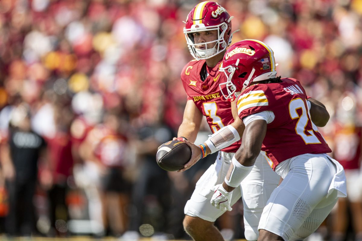 Iowa State quarterback Rocco Becht prepares to hand the ball off to Iowa State running back Abu Sama III during a football game between Iowa and No. 16 Iowa State in Ames, Iowa, on Sept. 6, 2025. 