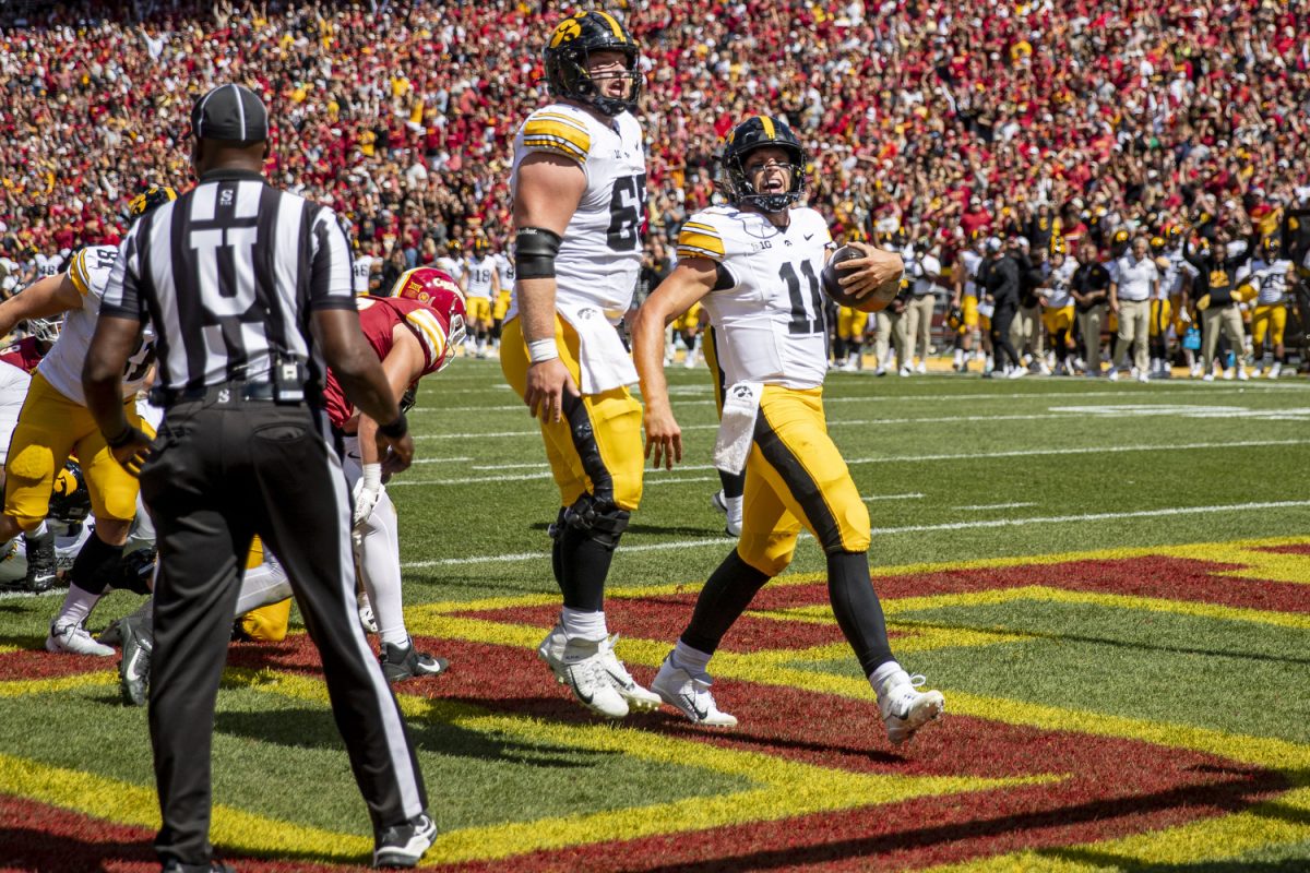 Iowa quarterback Mark Gronowski and Iowa offensive lineman Logan Jones celebrate a touchdown during a football game between Iowa and No. 16 Iowa State in Ames, Iowa, on Sept. 6, 2025. 
