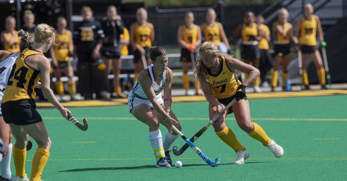 Iowa midfielder Gia Whalen moved the ball towards the goal during a field hockey match between no.15 Iowa and Queens at Grant Field in Iowa City on Sunday, Sept. 7, 2025. The Hawkeyes defeated the Royals 8-1.