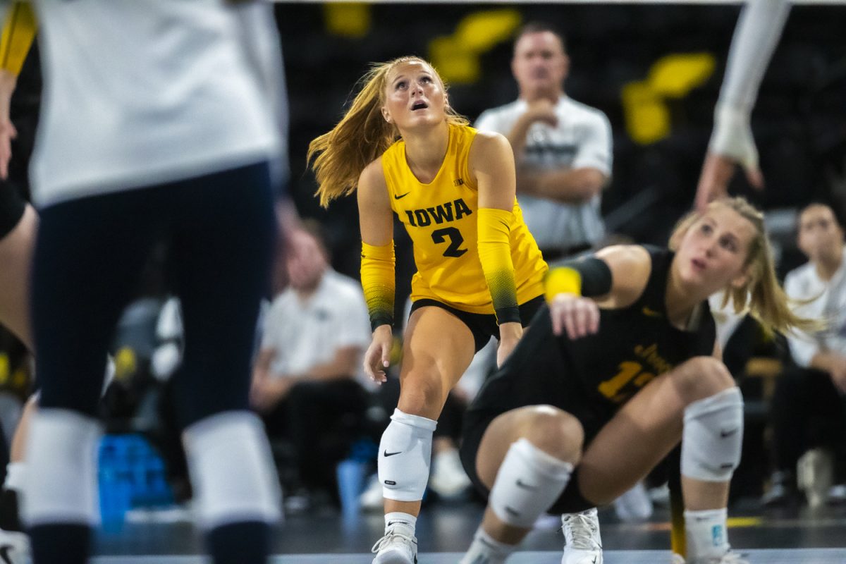 Iowa libero Milana Moisio watches intently over the net during the Hawkeye Invitational between the Iowa Hawkeyes and the East Texas A&M Lions at Xtream Arena in Coralville, Iowa on Friday, Sep 19, 2025. The Hawkeyes defeated the Lions in four sets. 